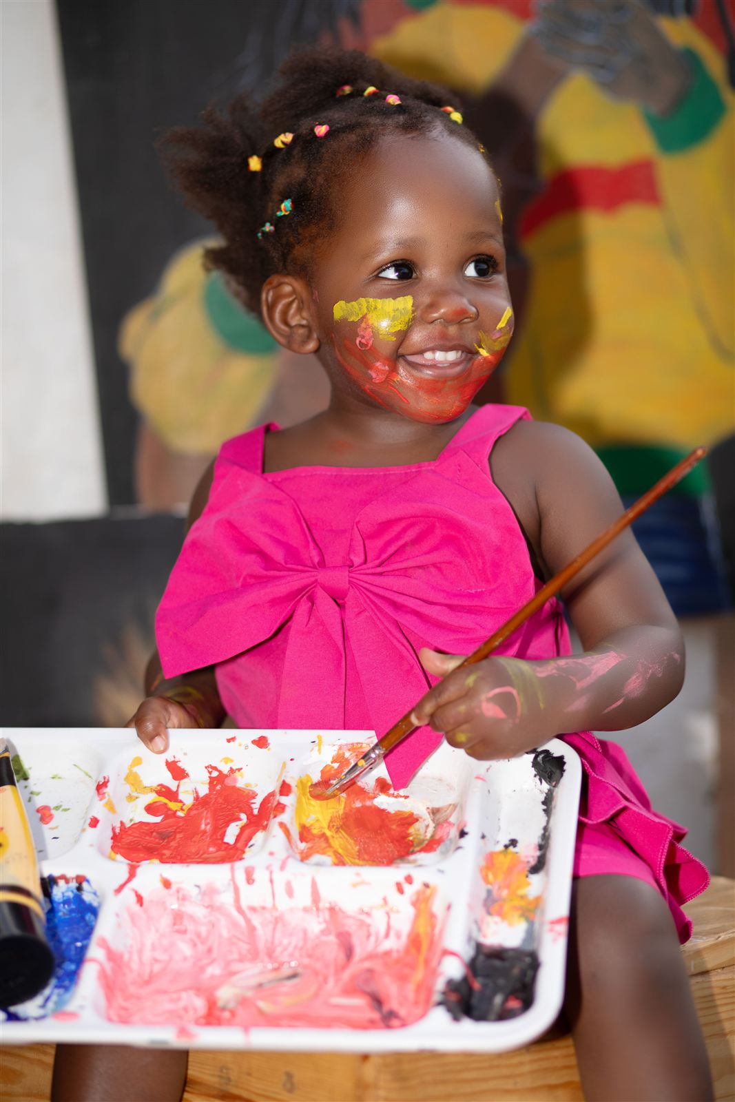 Child engaged in creative painting